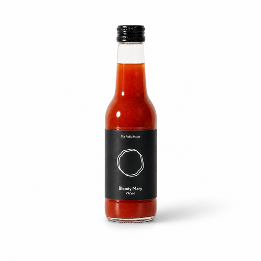 Bottle of Bloody Mary mix with a black label on a white background
